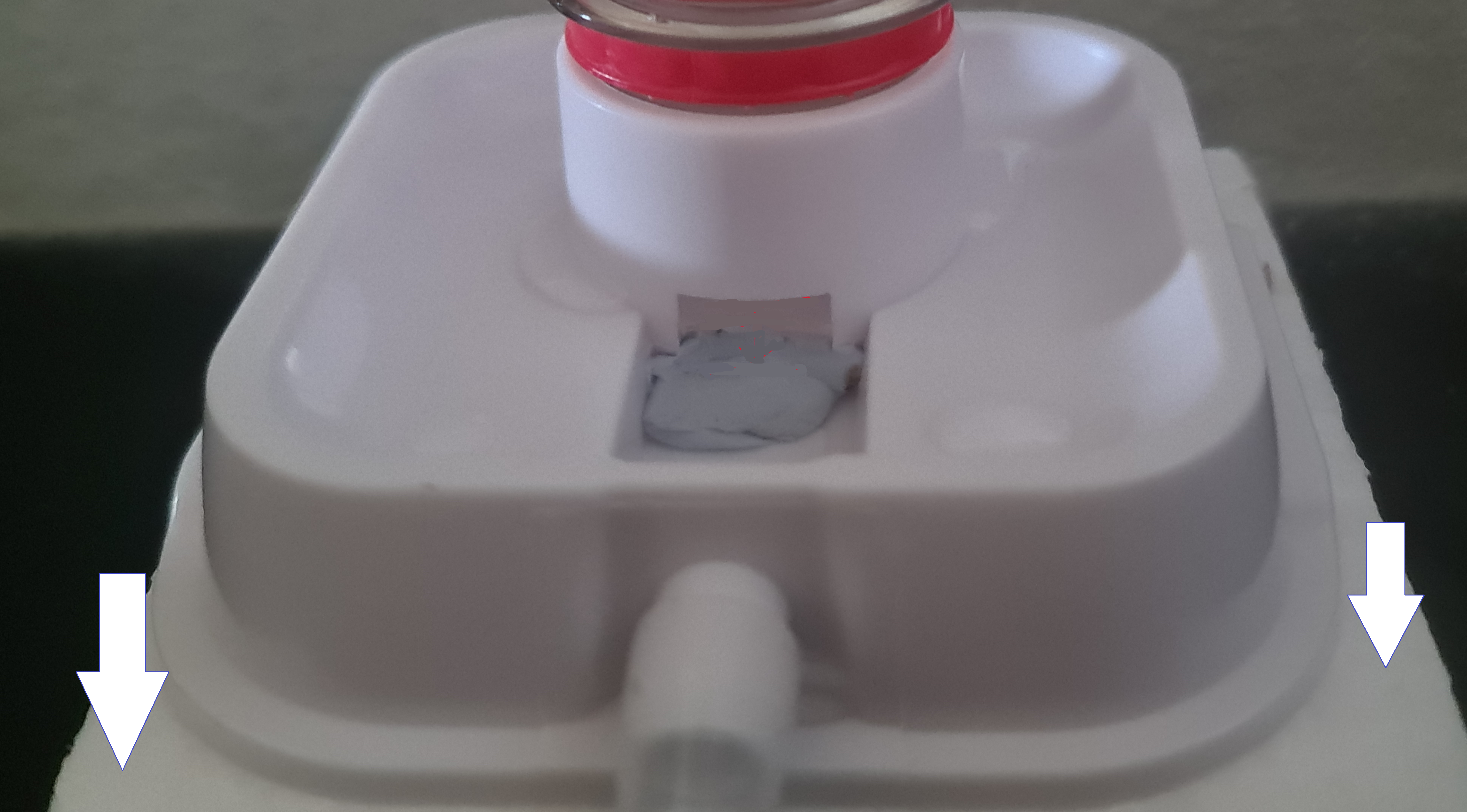 Image showing incubator water bottle stting on a foam pad